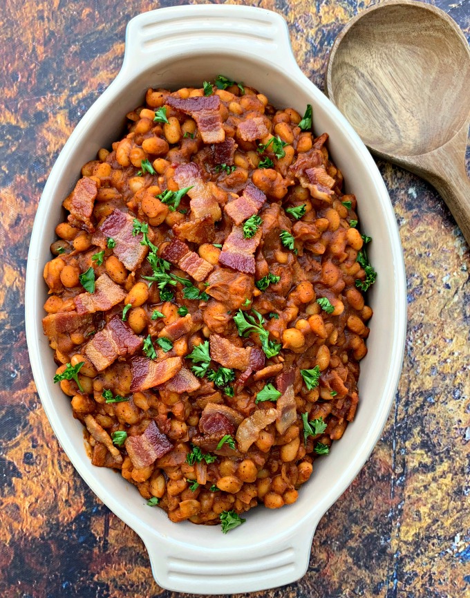 instant pot baked beans with bacon in a blue bowl