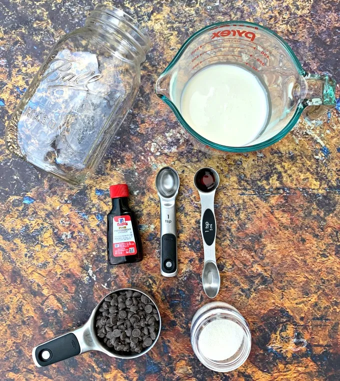 mason jar, heavy whipping cream, chocolate chips, sweetener, and vanilla for keto ice cream