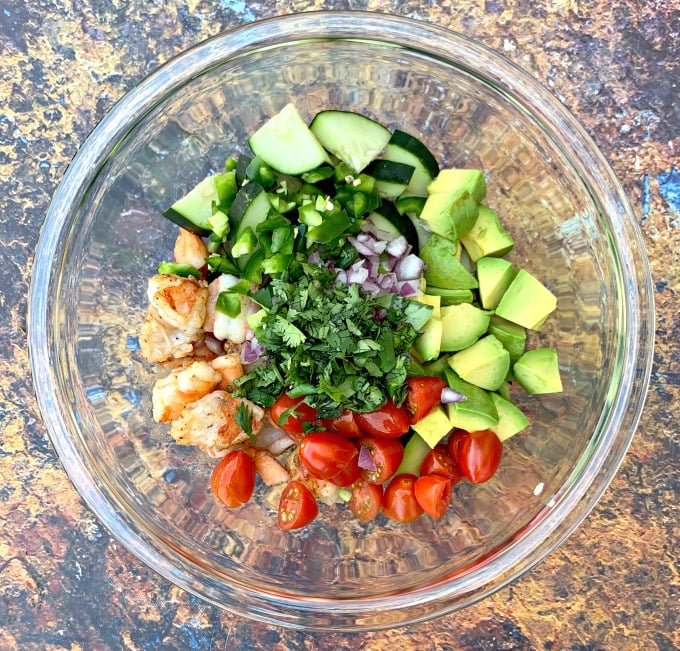 keto low carb shrimp avocado ceviche salad in a glass bowl