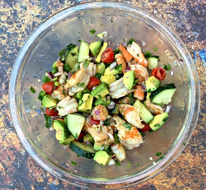 keto low carb shrimp avocado ceviche salad in a glass bowl