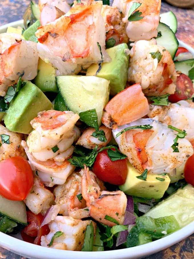 close up photo of keto low carb shrimp avocado ceviche salad in a white bowl