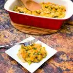 Keto Broccoli Cheese Casserole on a white plate and in a red baking dish