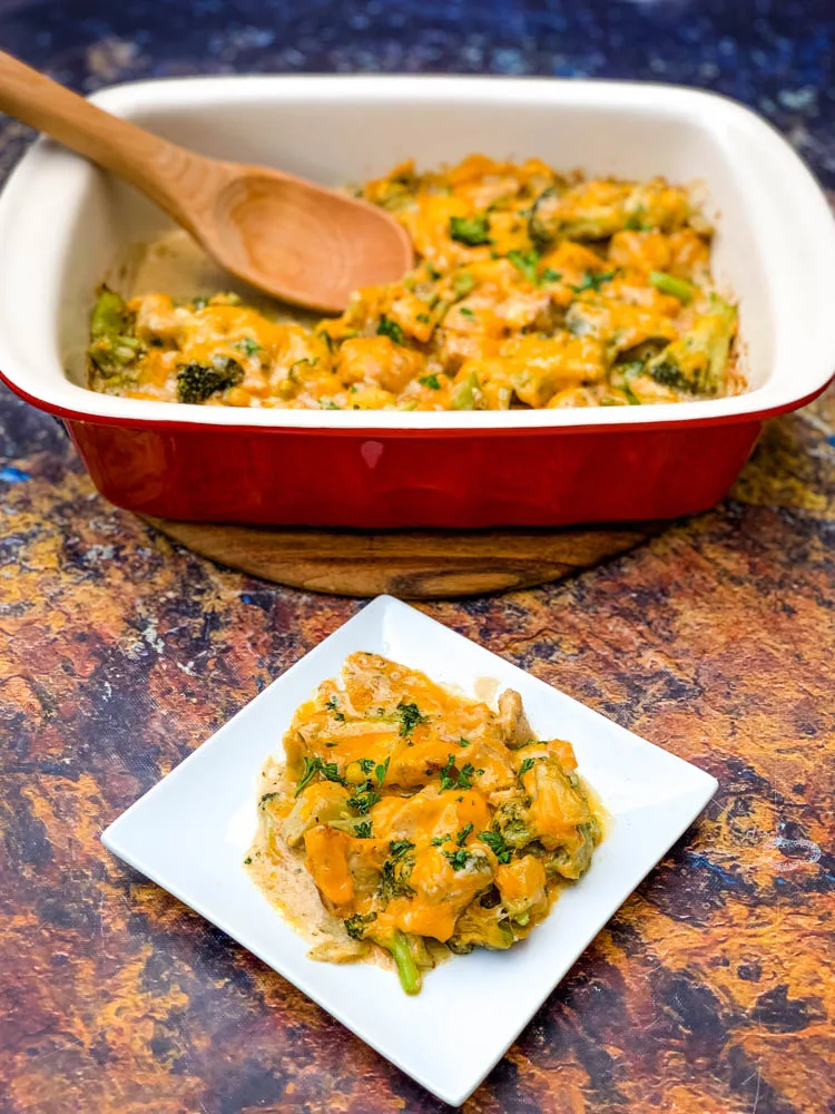 Keto Broccoli Cheese Casserole on a white plate and in a red baking dish