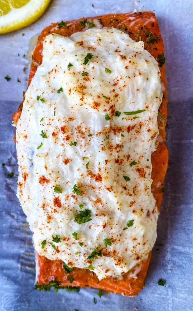 crab stuffed salmon on parchment paper