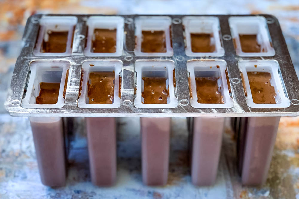 keto fudge popsicle mix in a popsicle mold