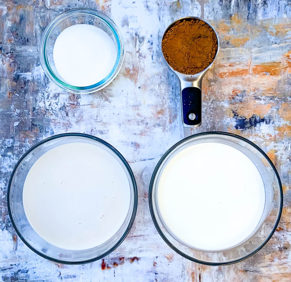 almond milk, heavy cream, unsweetened cocoa, and sweetener in glass bowls for keto fudge popsicles