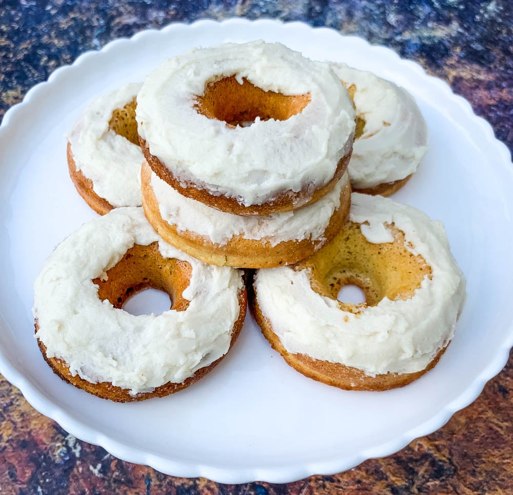 keto low carb donuts with frosted glaze on a white plate