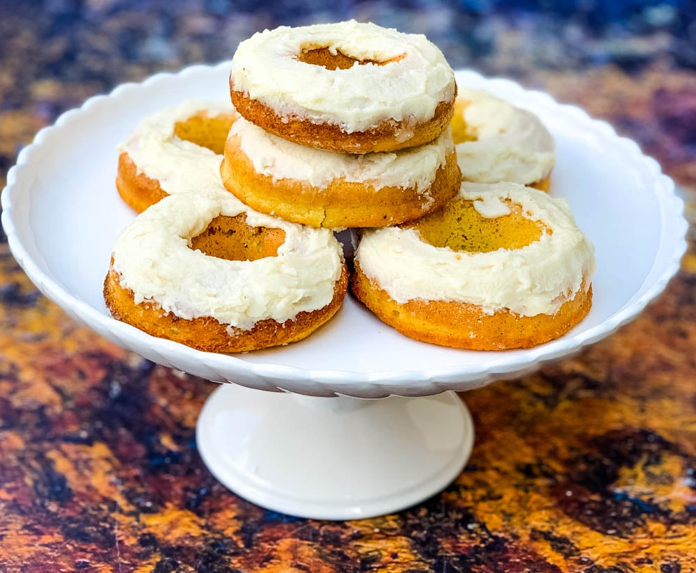 keto low carb glazed donuts on a white dessert tray