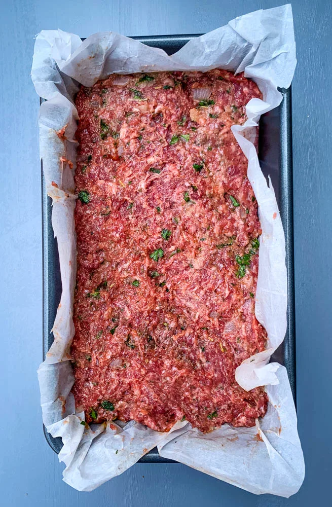 raw keto low carb meatloaf in a loaf pan