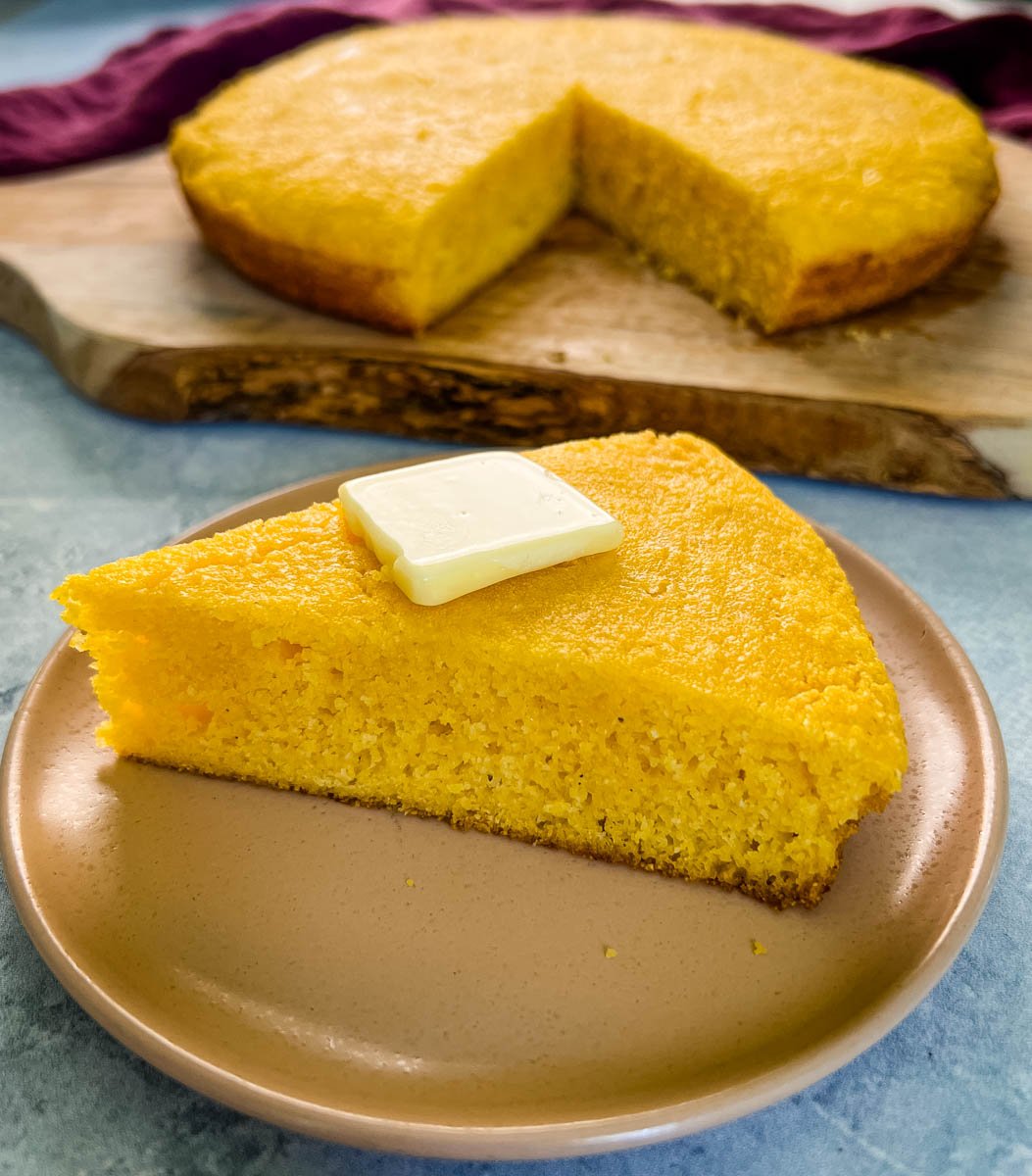 overhead shot of cornbread in a cast iron skillet and southern cornbread on a plate