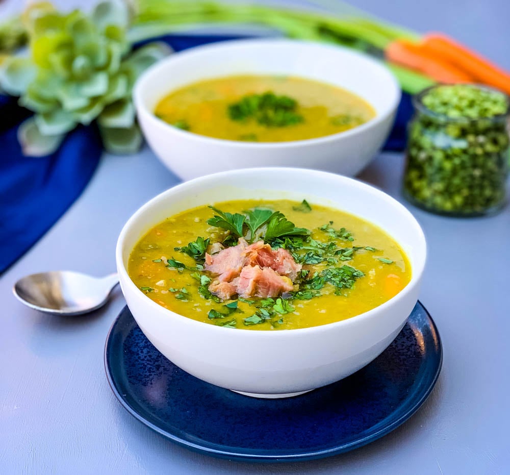 instant pot split pea soup in a white bowl on a blue plate