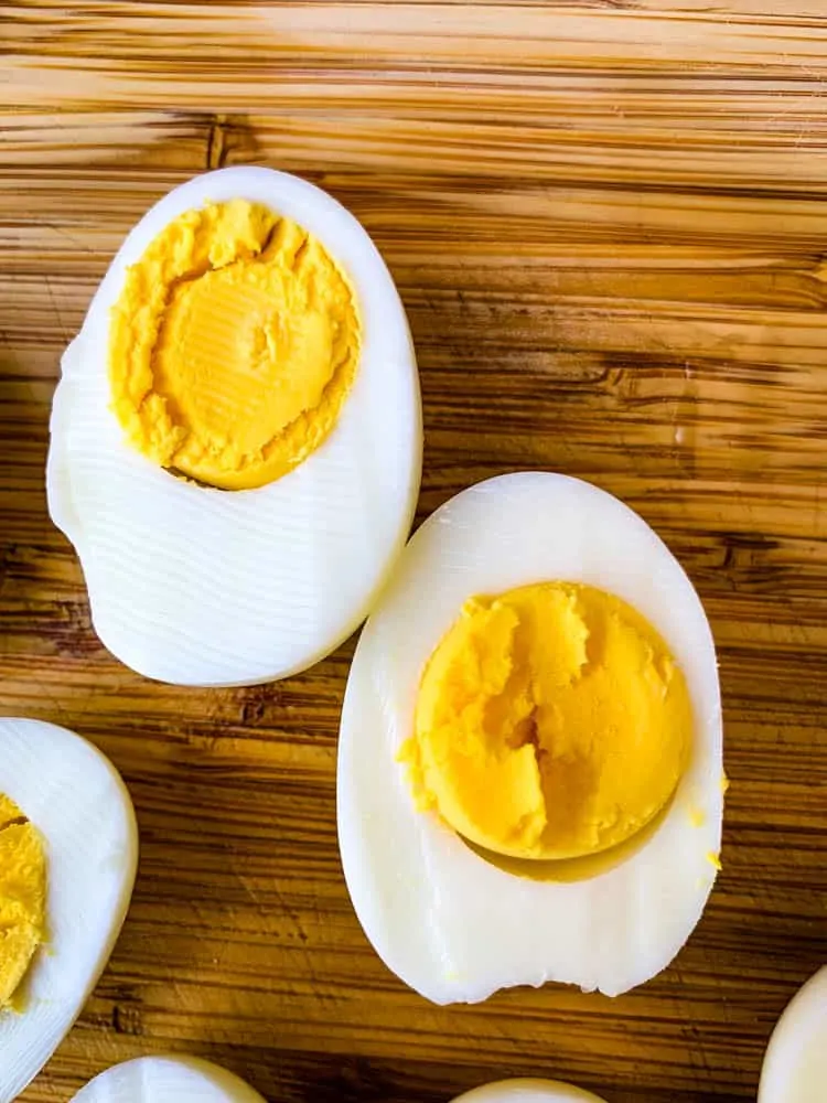 air fryer hard boiled eggs on a bamboo cutting board