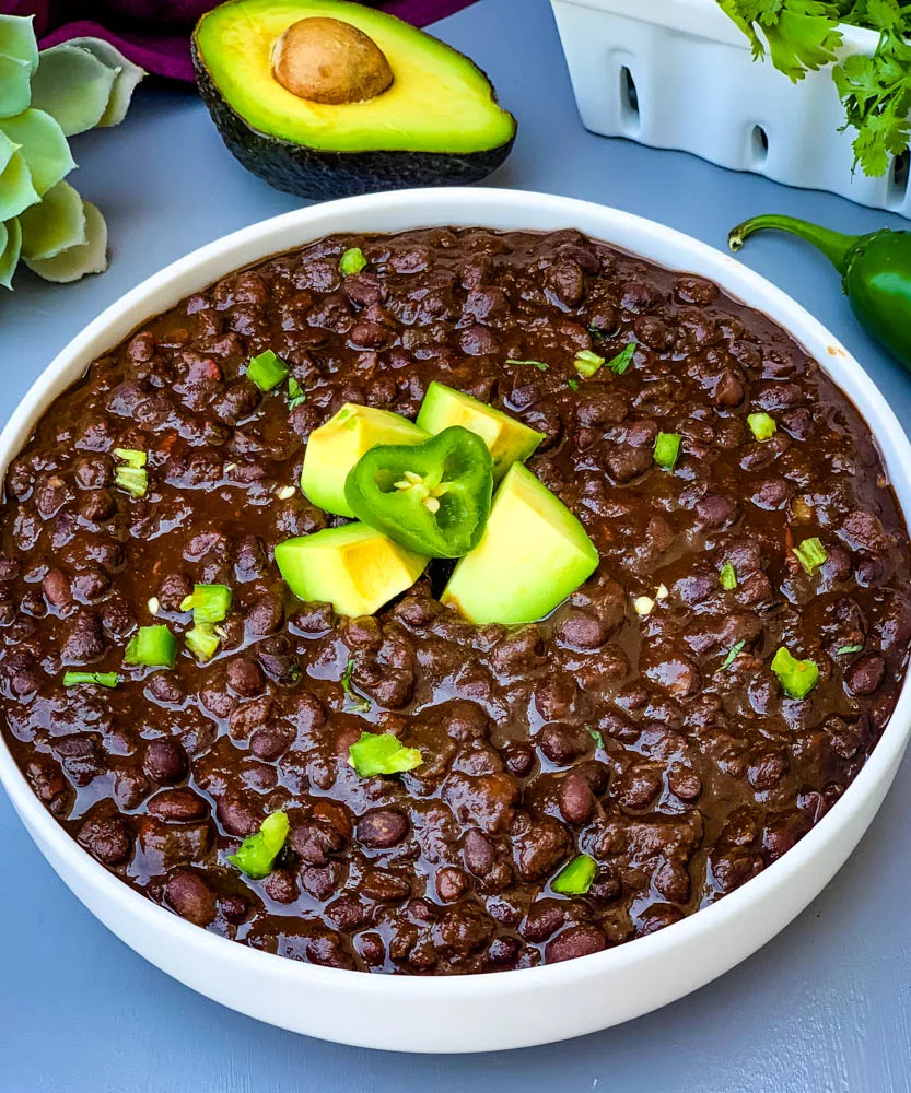 instant pot black bean soup in a white bowl