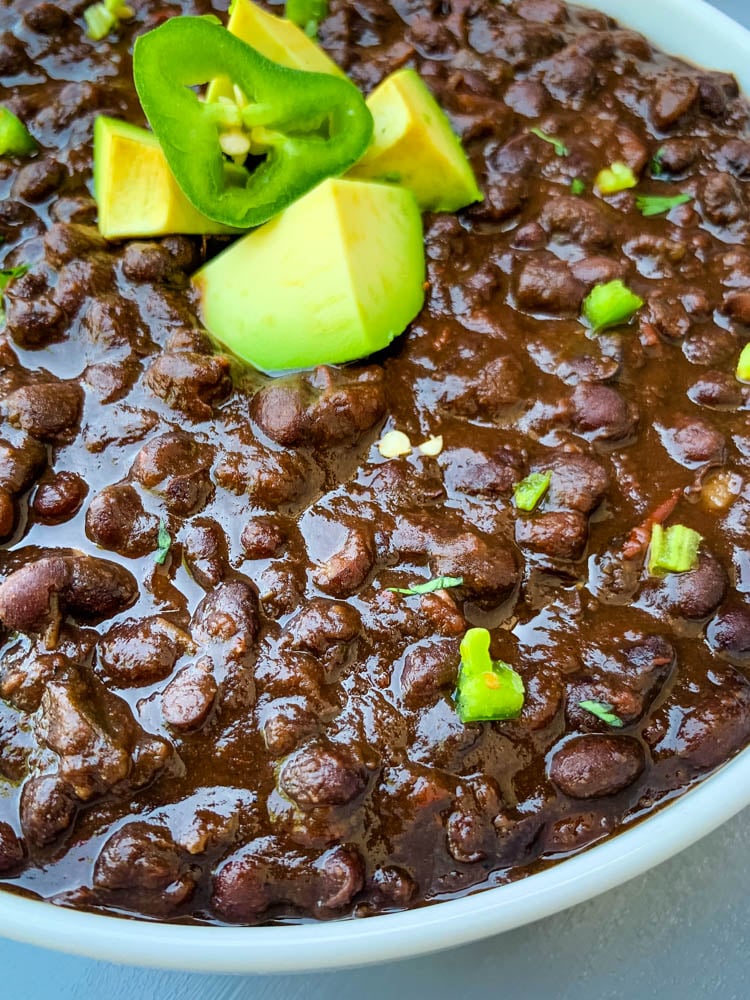 instant pot black bean soup in a white bowl