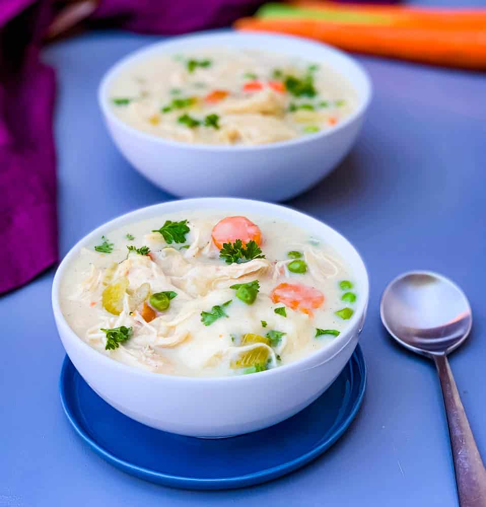 instant pot chicken and dumplings from scratch in 2 white bowls