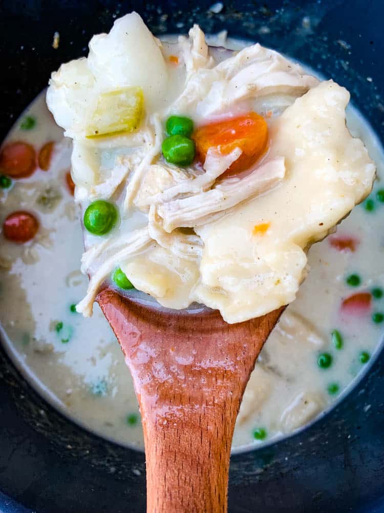 instant pot chicken and dumplings from scratch with a wooden spoon in an Instant Pot
