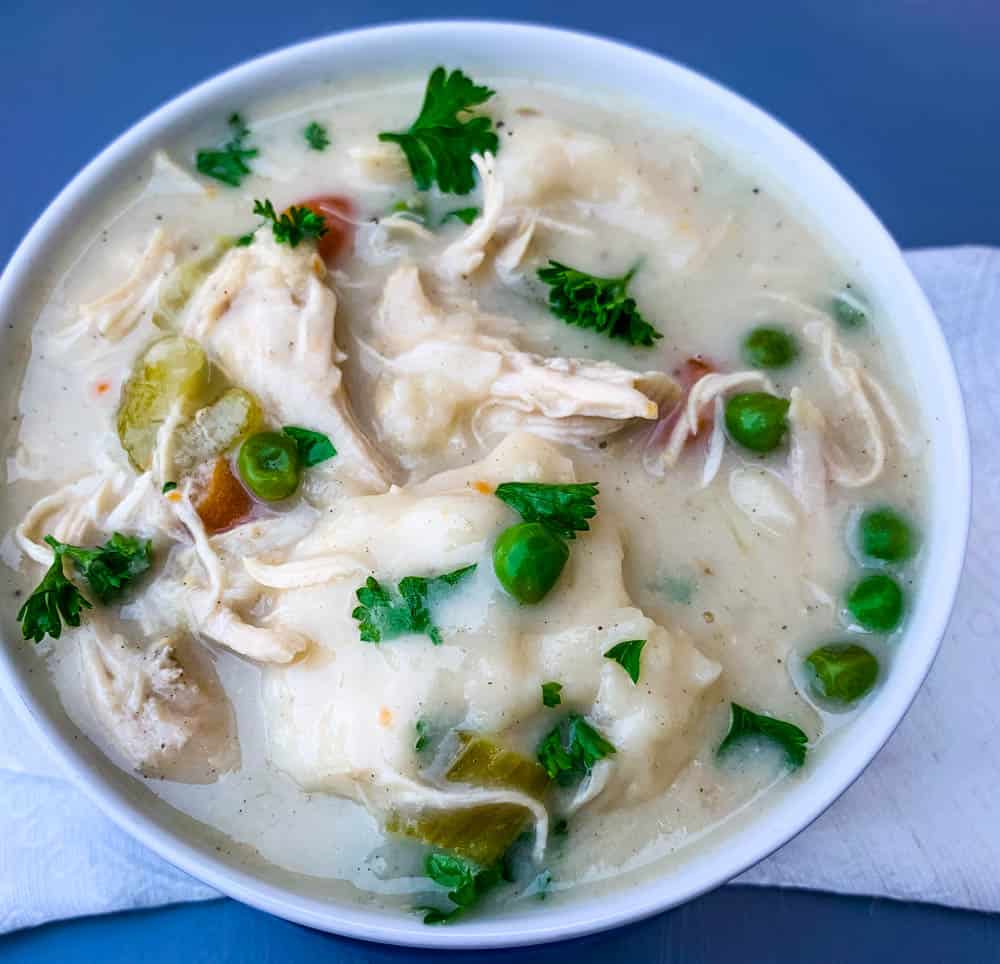 instant pot chicken and dumplings from scratch in a white bowl