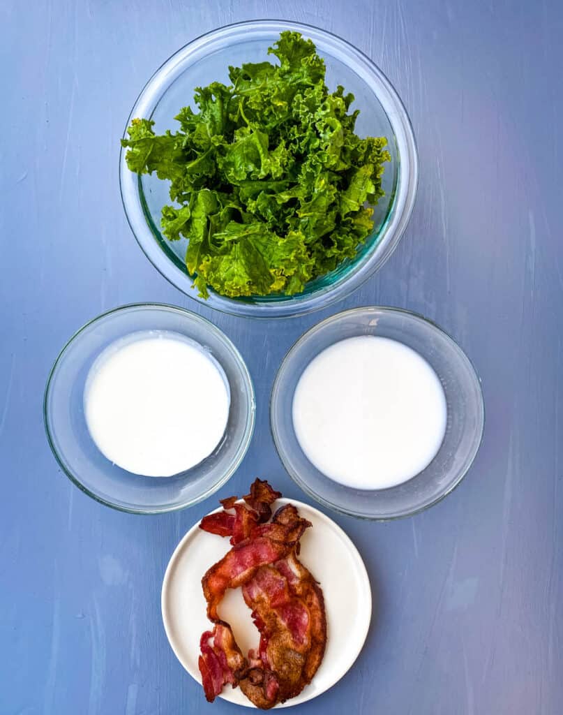 fresh kale, cooked bacon, heavy cream, and almond milk in separate bowls