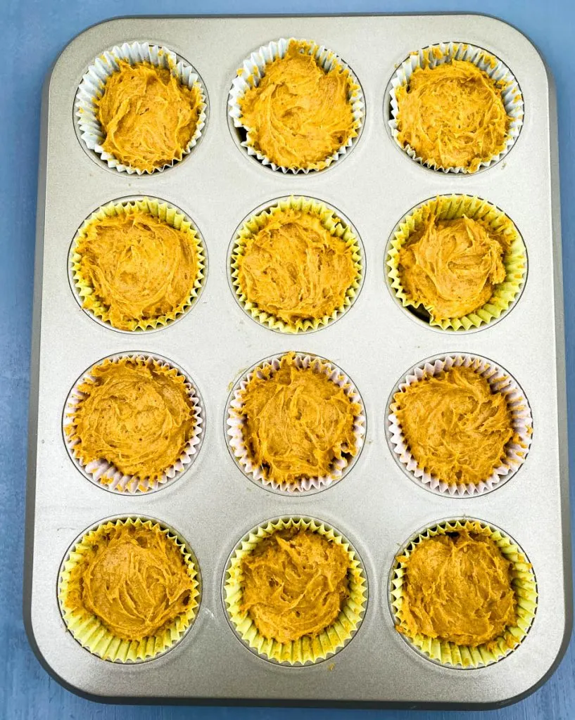 keto pumpkin muffins unbaked in a muffin tin