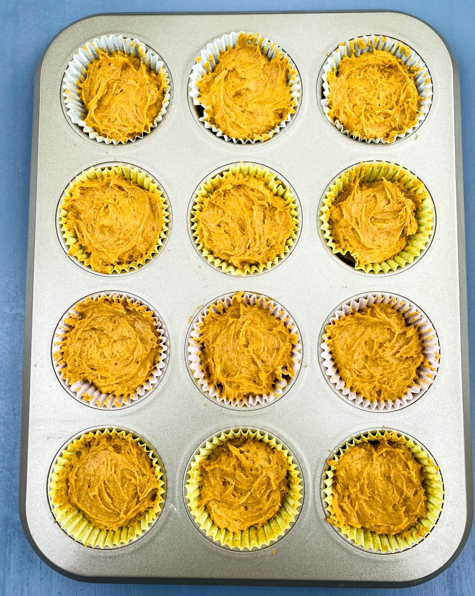 keto low carb pumpkin muffins on a blue plate with butter