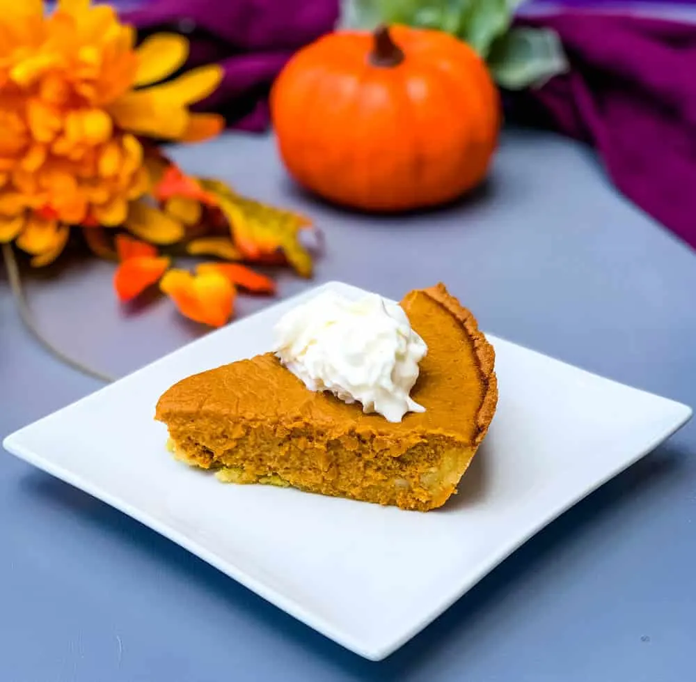 keto low carb pumpkin pie on a white plate with a