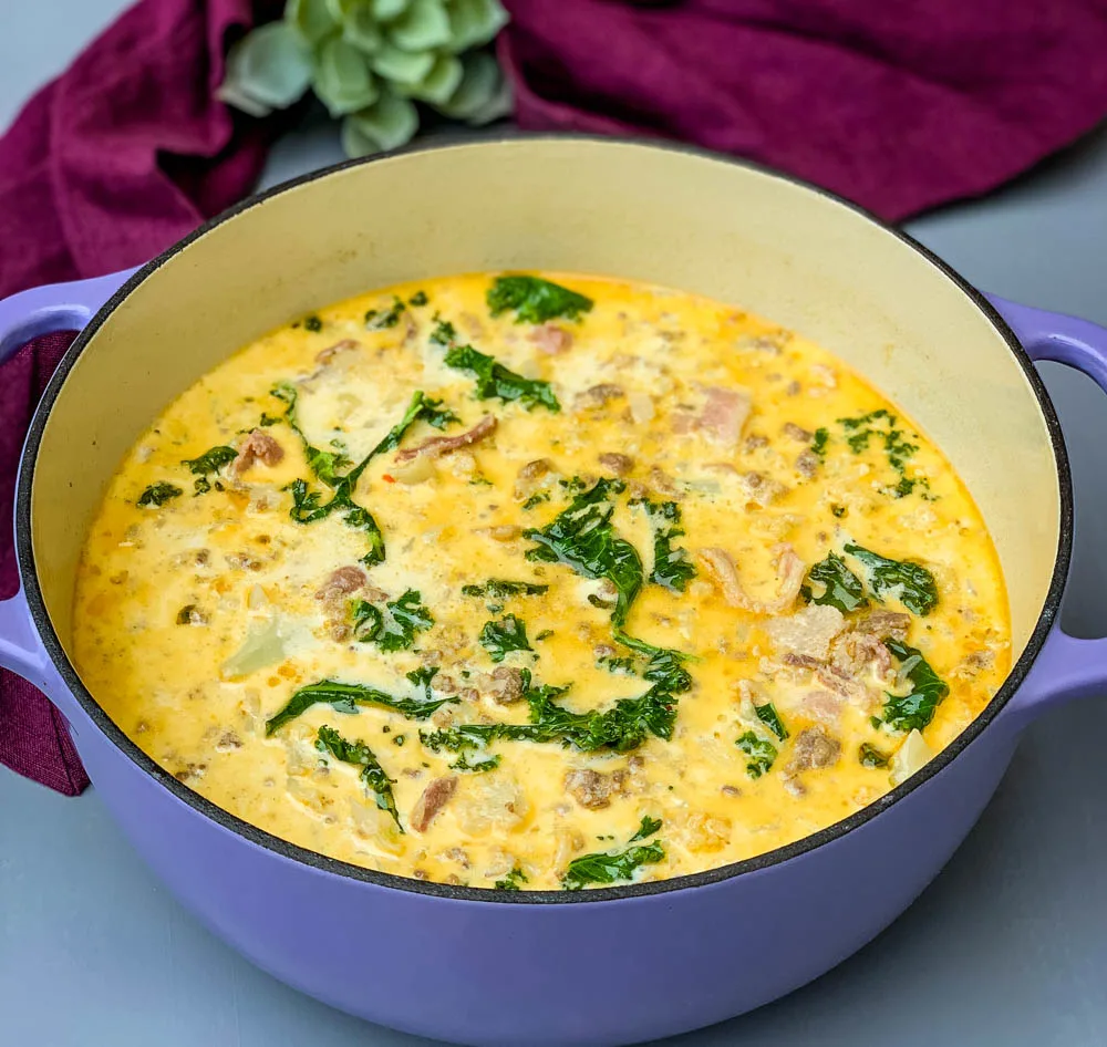 keto low carb zuppa toscana soup in a purple cast iron Dutch oven