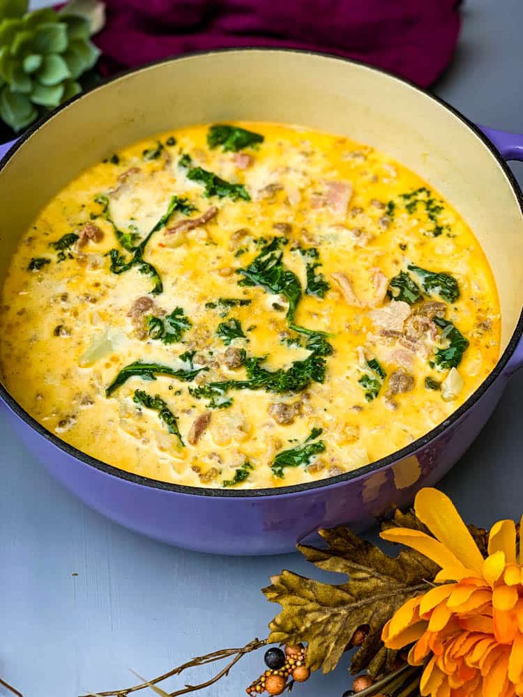 keto low carb zuppa toscana soup in a purple cast iron Dutch oven