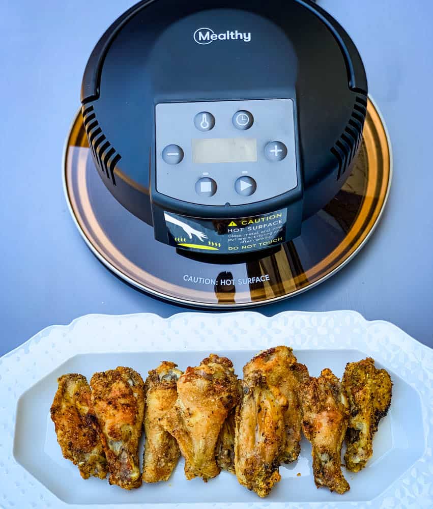 Mealthy crisp lid and air fryer chicken wings on a white plate