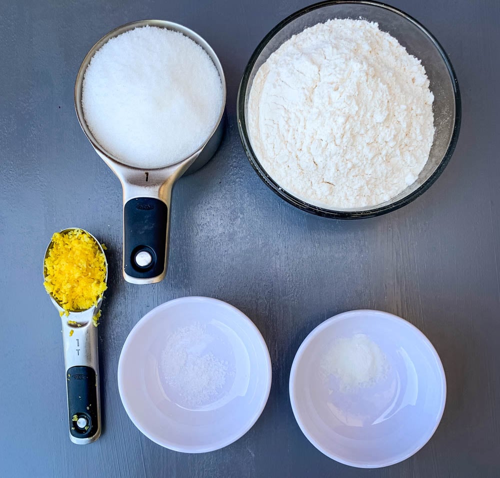 sugar, lemon zest, and flour in bowls for air fryer cake