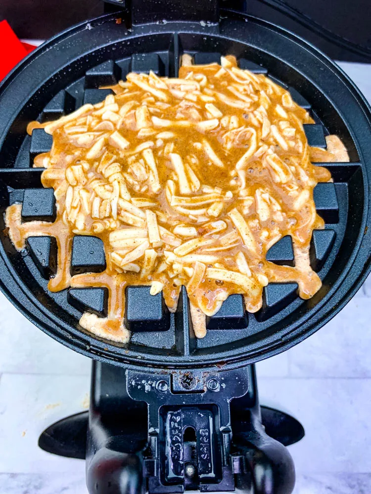 chaffles batter in a waffle iron