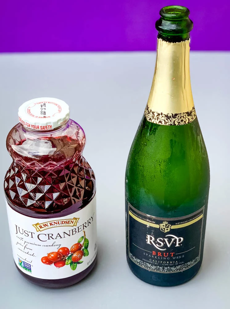 cranberry juice and champagne in bottles