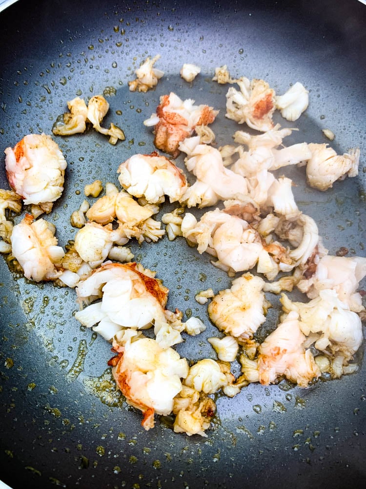 sauteed lobster and butter in a skillet