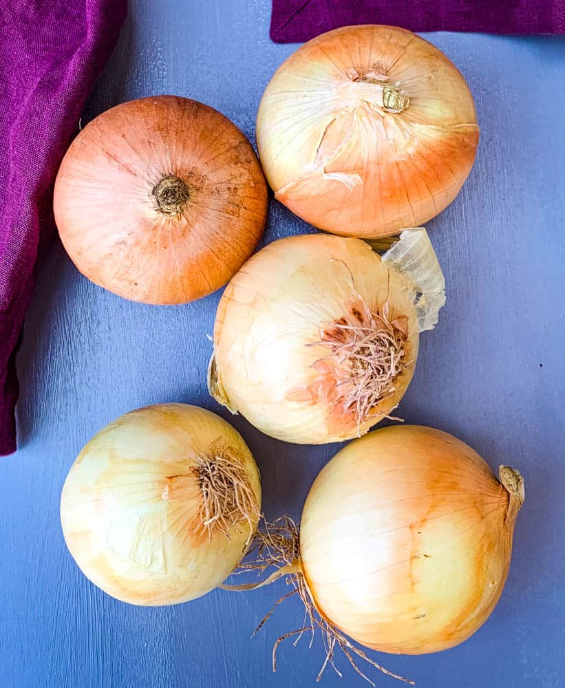 yellow onions on a flat surface