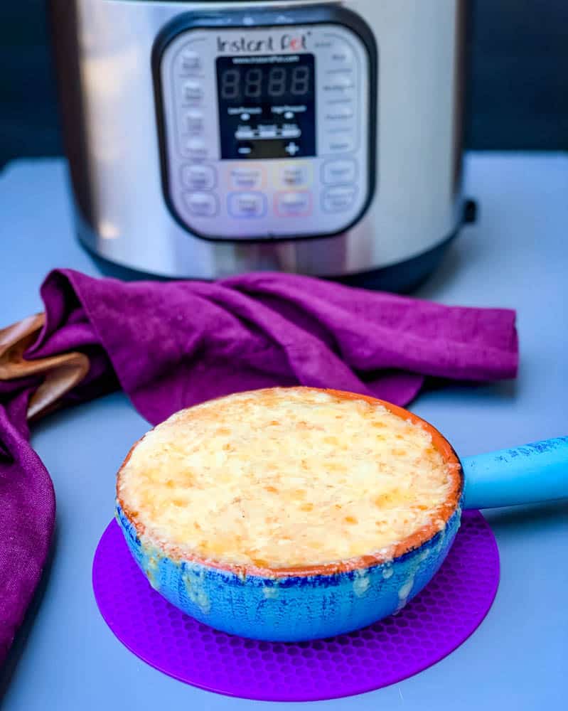 Instant Pot French onion soup in a bowl with cheese