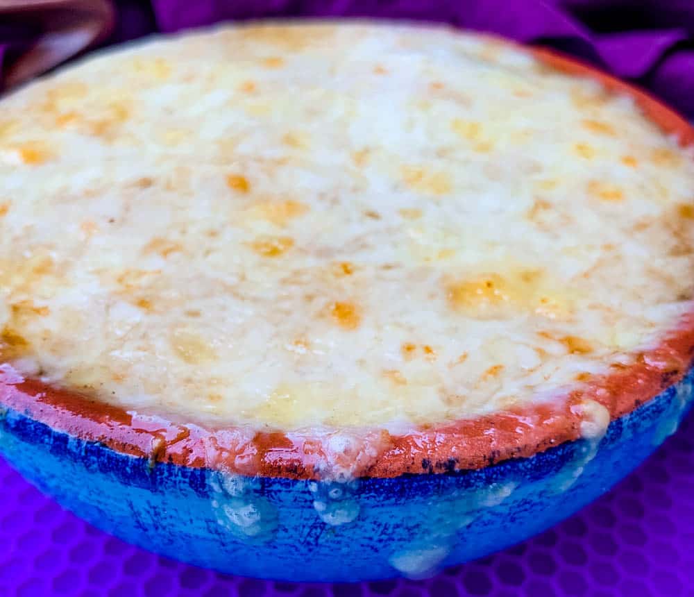 Instant Pot French onion soup in a bowl with cheese