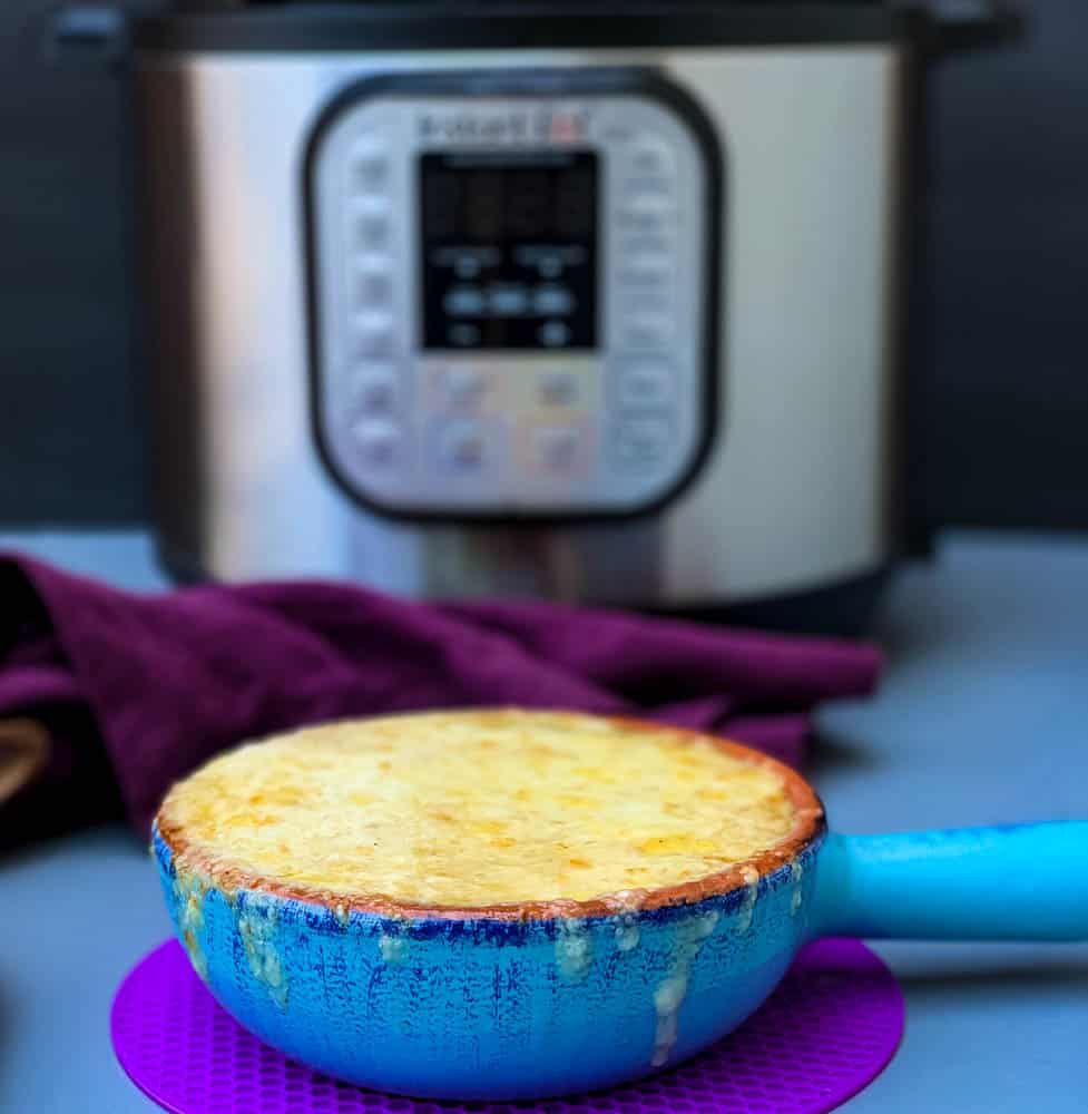 Instant Pot French onion soup in a bowl with cheese