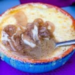 Instant Pot French onion soup in a bowl with cheese