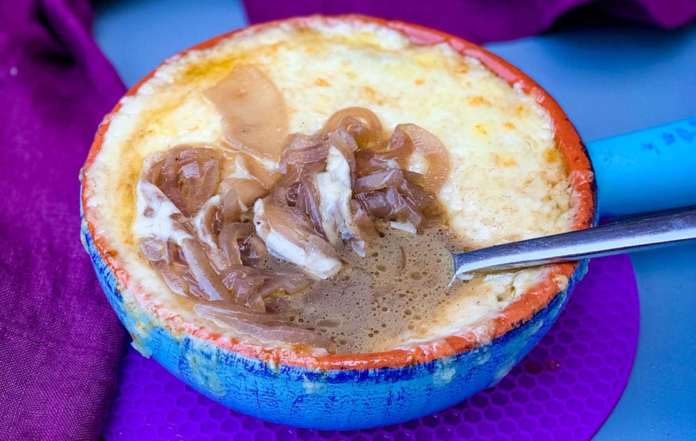 Instant Pot French onion soup in a bowl with cheese