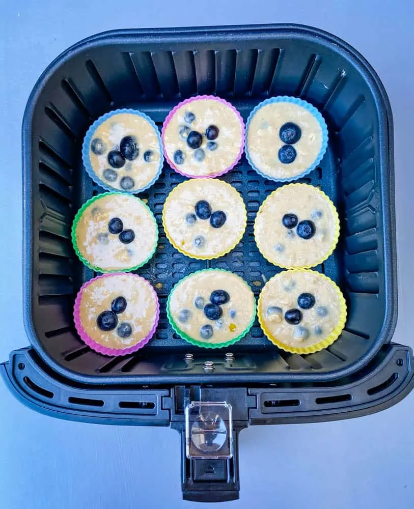 uncooked blueberry muffins in an air fryer