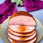 air fryer honey glazed ham on a green and gold plate