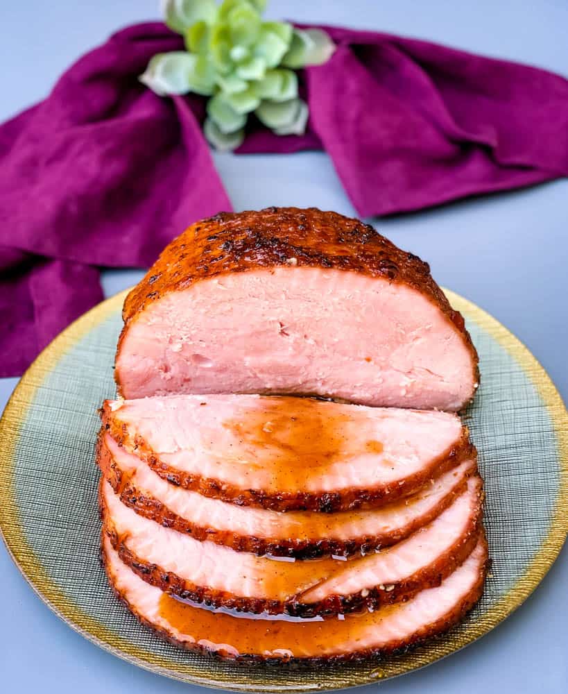 air fryer honey glazed ham on a green and gold plate
