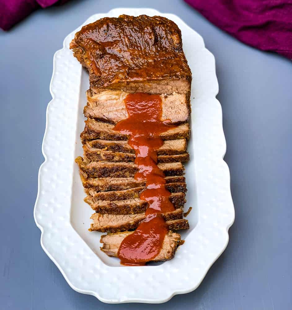 Instant Pot Beef Brisket with BBQ Sauce on a white plate