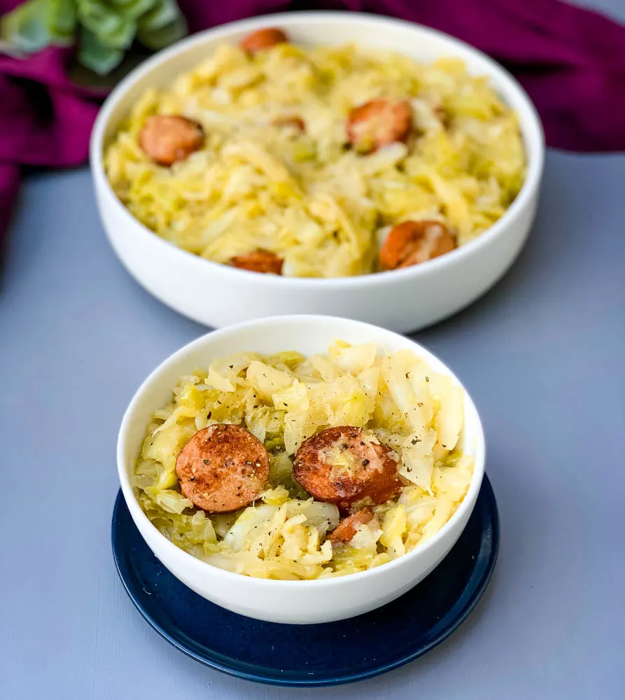 instant pot cabbage and sausage in a white bowl
