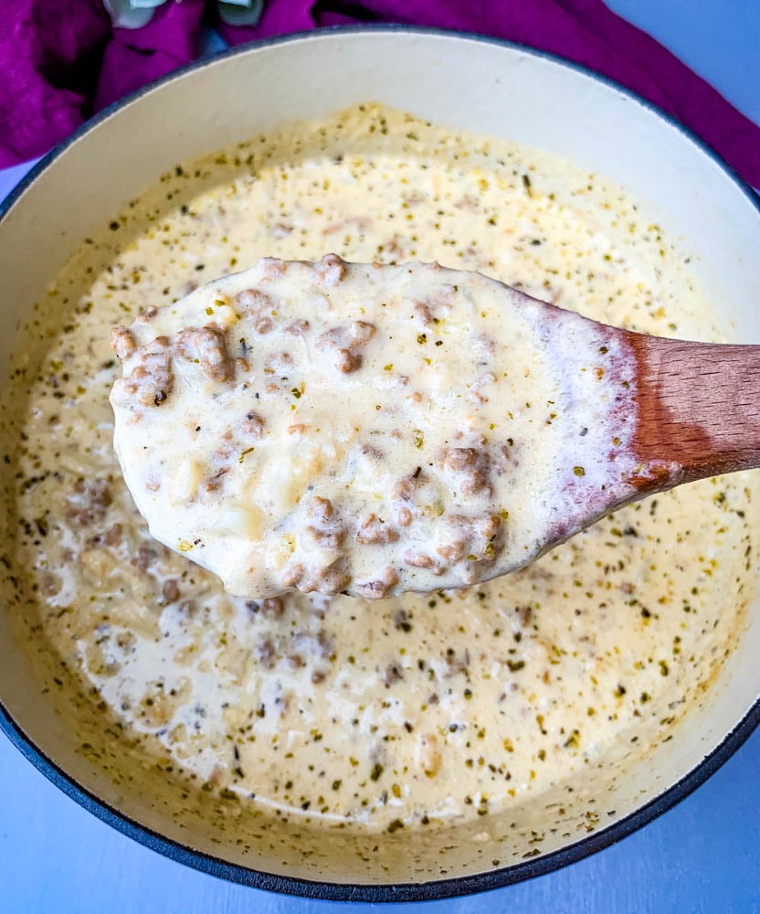 a wooden spoon with a scoop of keto cheeseburger soup