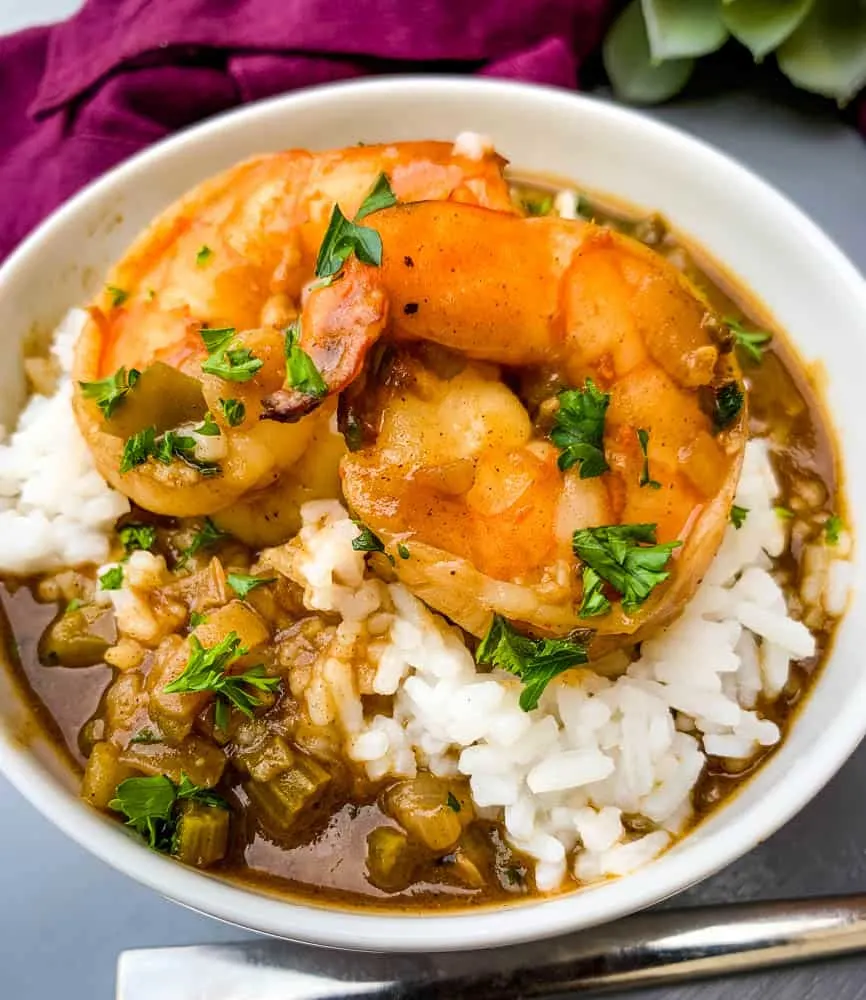 shrimp etouffee with white rice in a white bowl