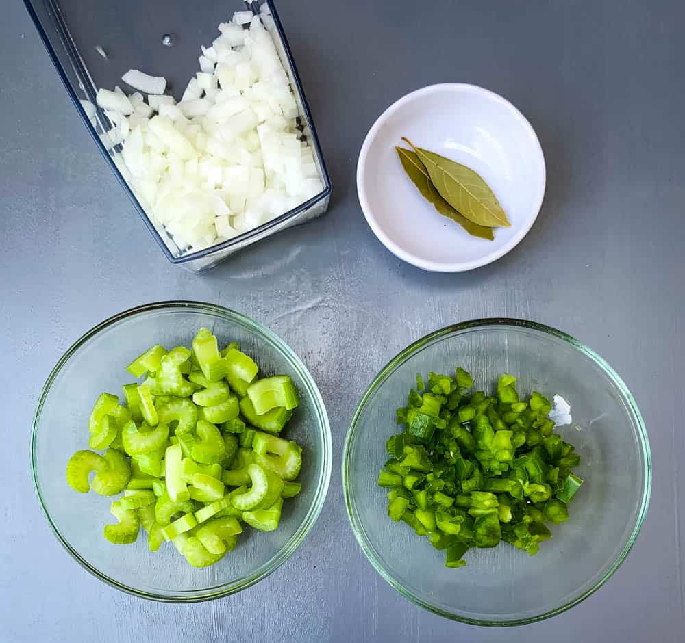 chopped onions, celery, green peppers, and bay leaves for shrimp etouffee