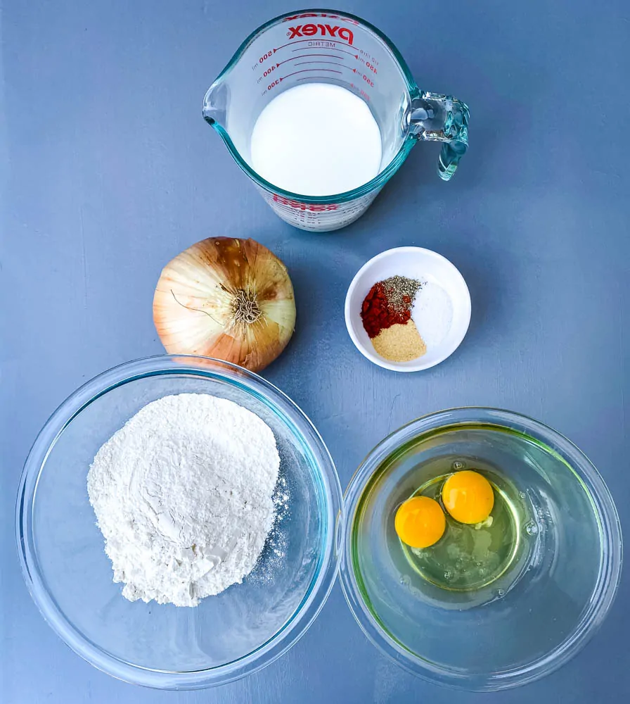 milk, flour, onion, seasoning, and eggs for air fryer blooming onion batter