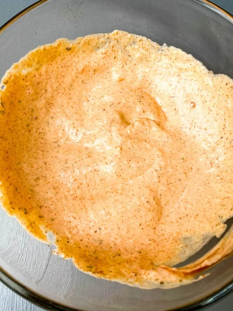 air fryer blooming onion dipping sauce in a glass bowl