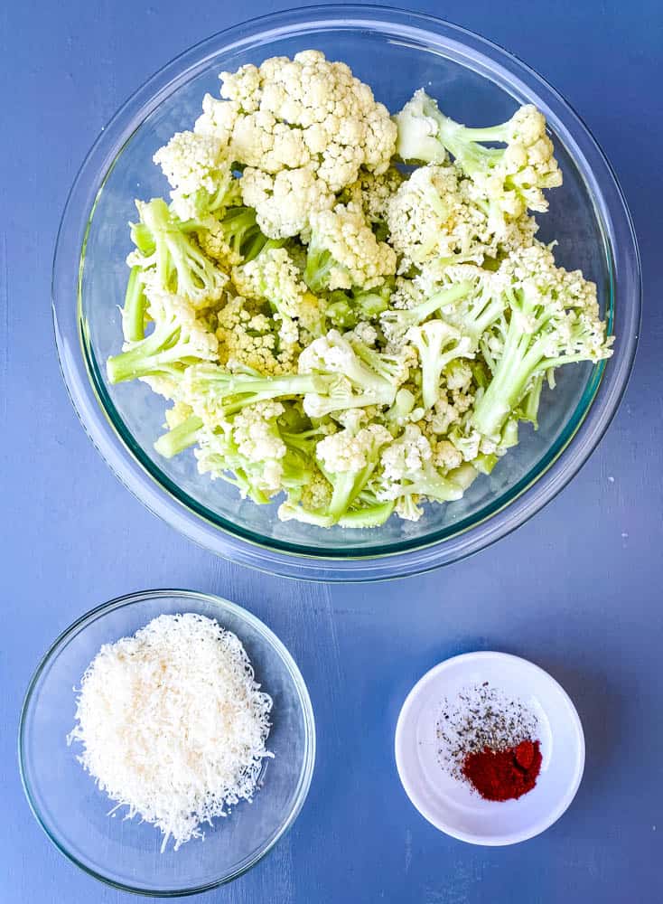 fresh caulilini, parmesan cheese, and smoked paprika in bowls