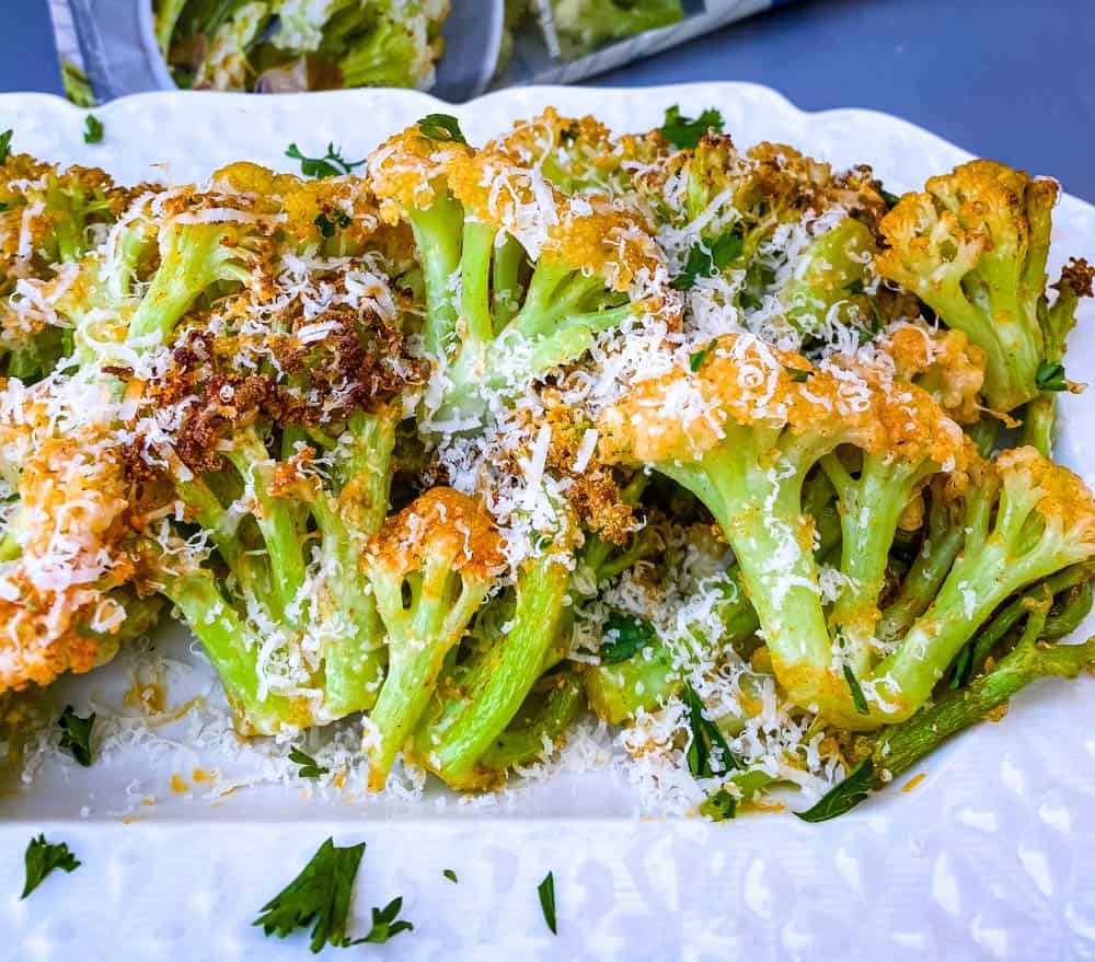 air fryer caulilini on a white plate